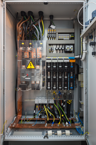 Upgraded electrical panel with organized wiring and components, showing a modern and efficient setup.